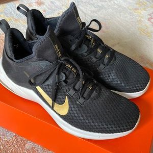 Nike Air - Black with gold swish, minimal wear.